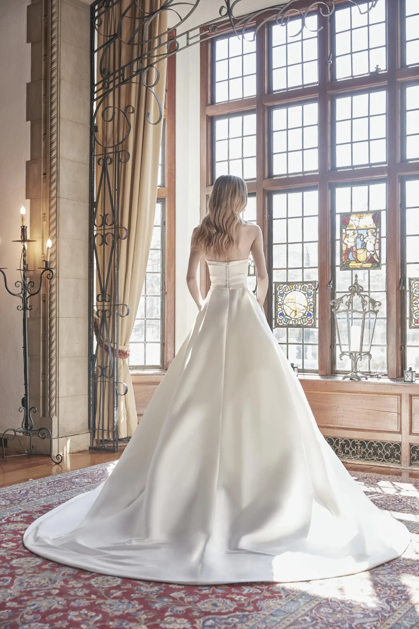Model is wearing a bridal ball gown with a ruched bodice by sareh nouri