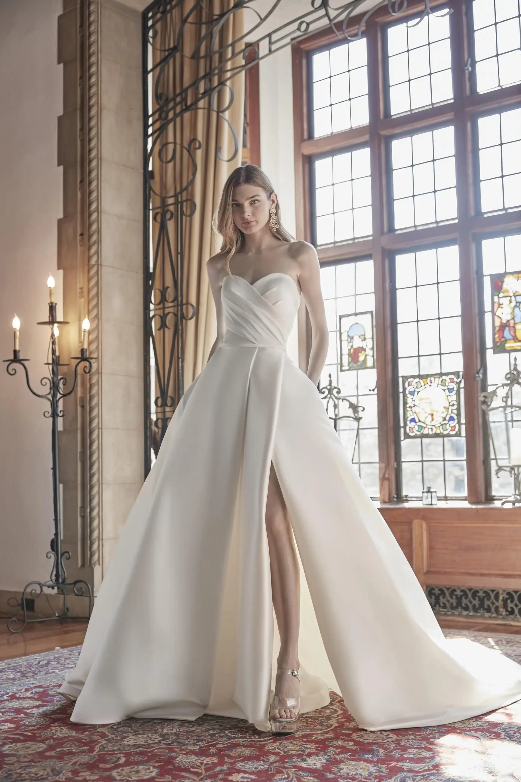 Model is wearing a bridal ball gown with a ruched bodice by sareh nouri
